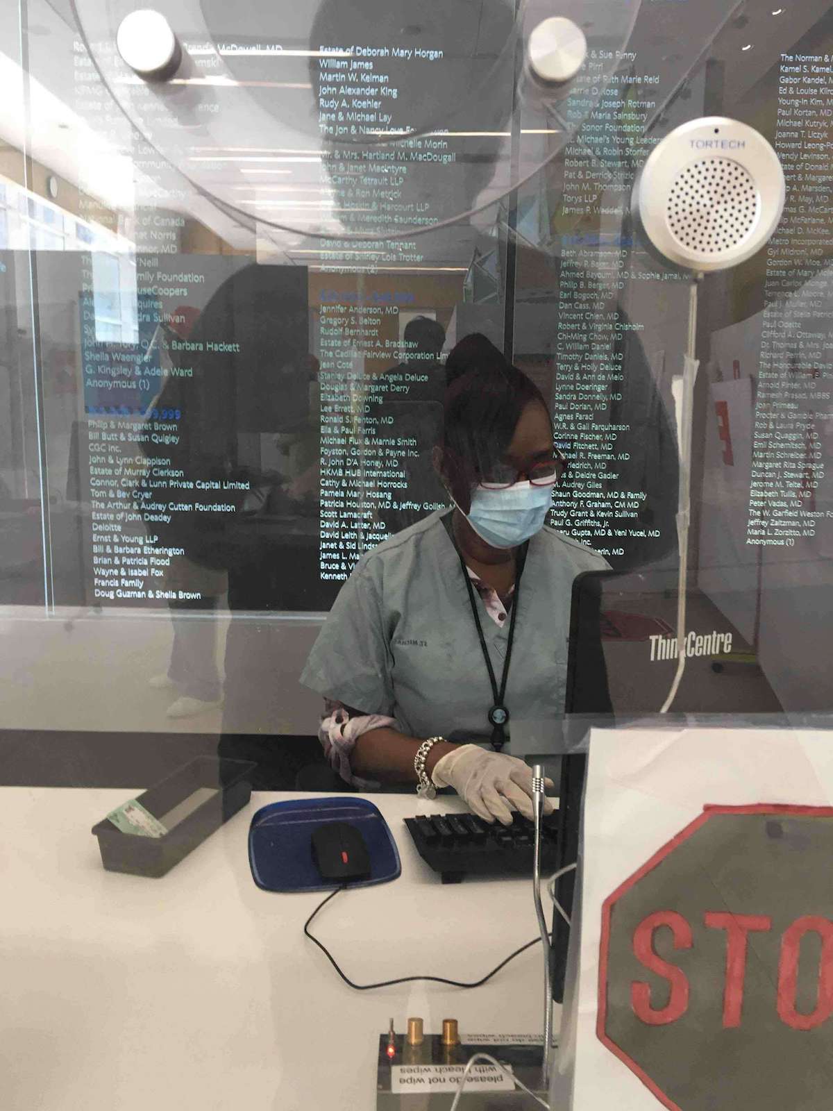 At the counter giving information to Hospital staff